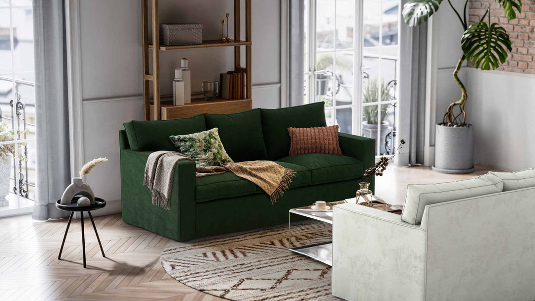 Nordic Minimalist living room with Room and Board Metro sofa in Performance Weave Stone and Classic Velvet Forest Green slipcover