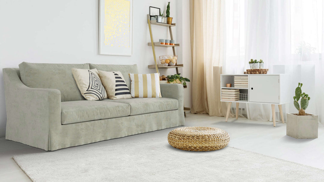 Bohemian living room with Crate and Barrel Verrano II Slope Arm sofa in Performance Weave Stone fabric slipcover