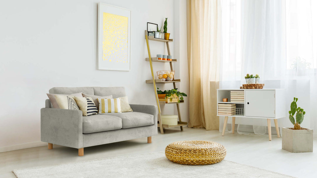 Bohemian living room with Muji Slim Arm Sofa in Performance Weave Stone fabric slipcover