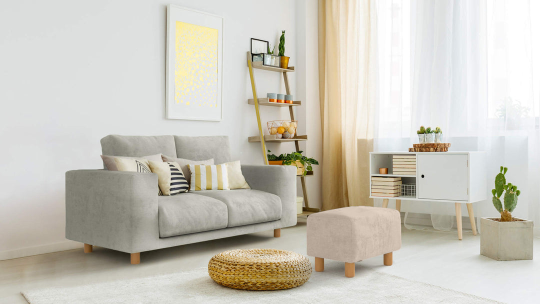 Bohemian living room with Muji Polyurethane Ottoman sofa in Performance Weave Stone and Performance Weave Cream slipcover