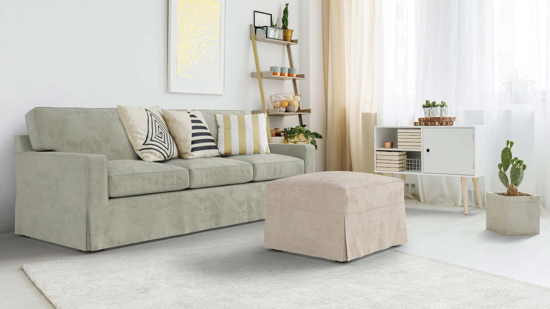 Bohemian living room with Pottery Barn Buchanan sofa in Performance Weave Stone and Performance Weave Cream slipcover