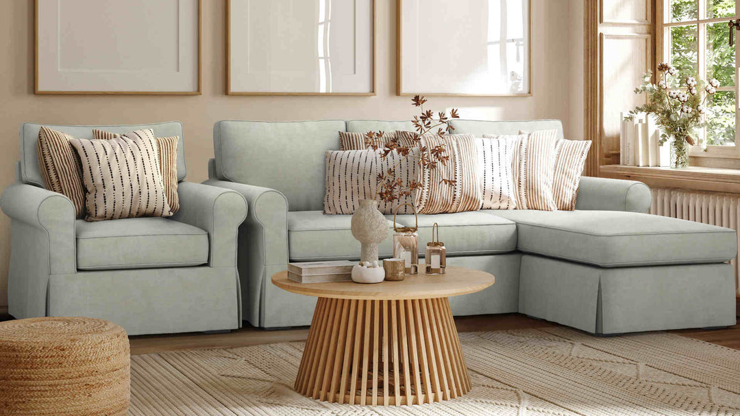 Nordic Minimalist living room with Pottery Barn Buchanan Roll Arm sofa in Performance Weave Stone slipcover