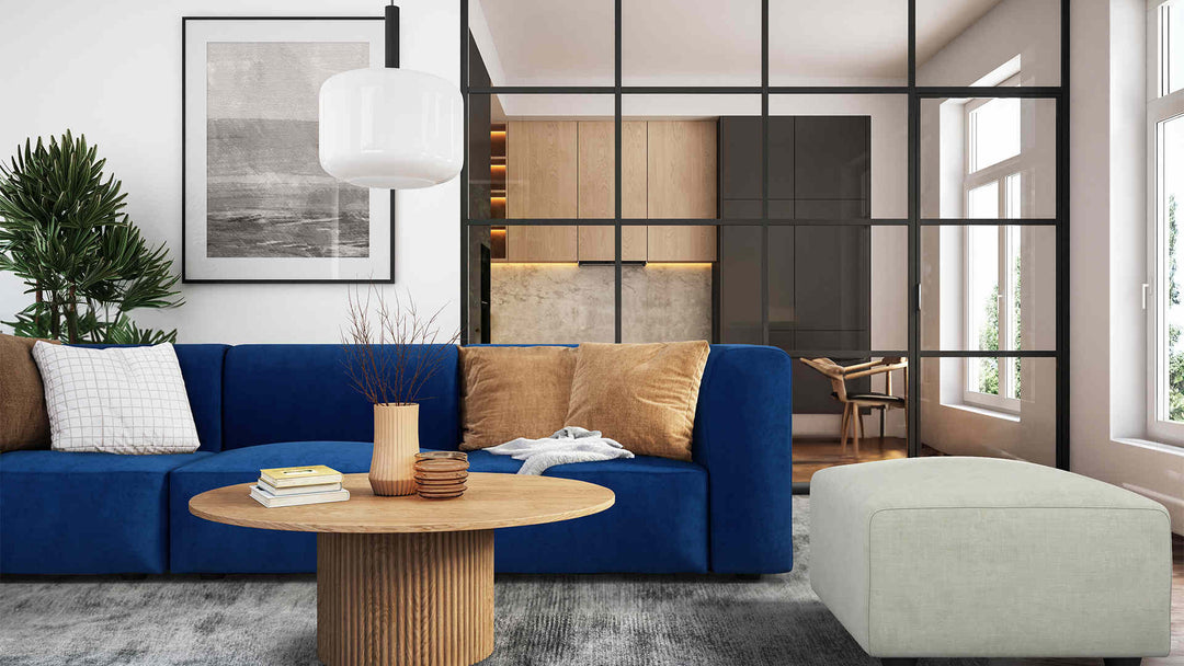 Modern living room with Muji Unit Sofa in Classic Velvet Cobalt and Performance Weave Stone slipcover