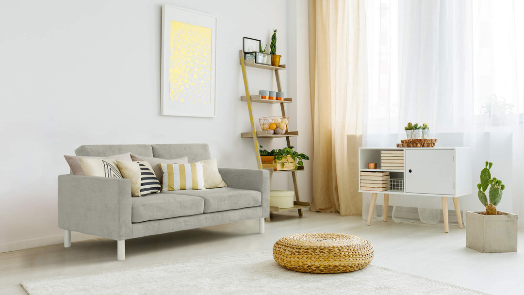 Bohemian living room with Muji Leather Sofa in Performance Weave Stone fabric slipcover