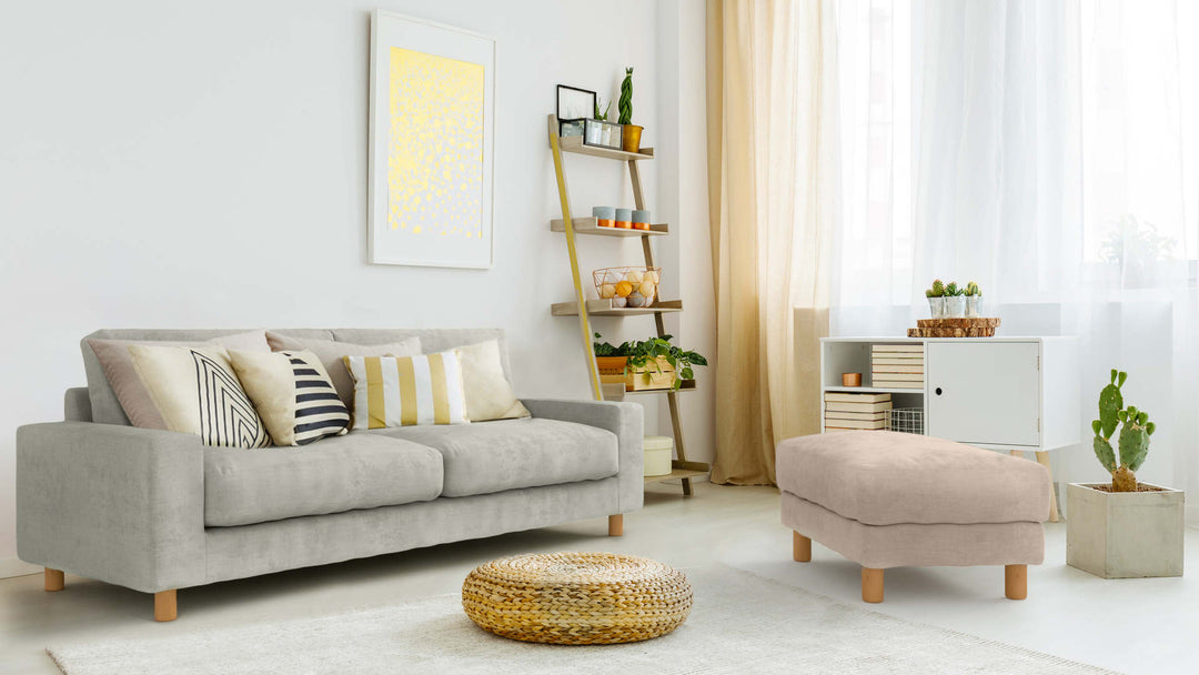 Bohemian living room with Muji Feather Pocket Coil Ottoman in Performance Weave Stone and Performance Weave Cream slipcover