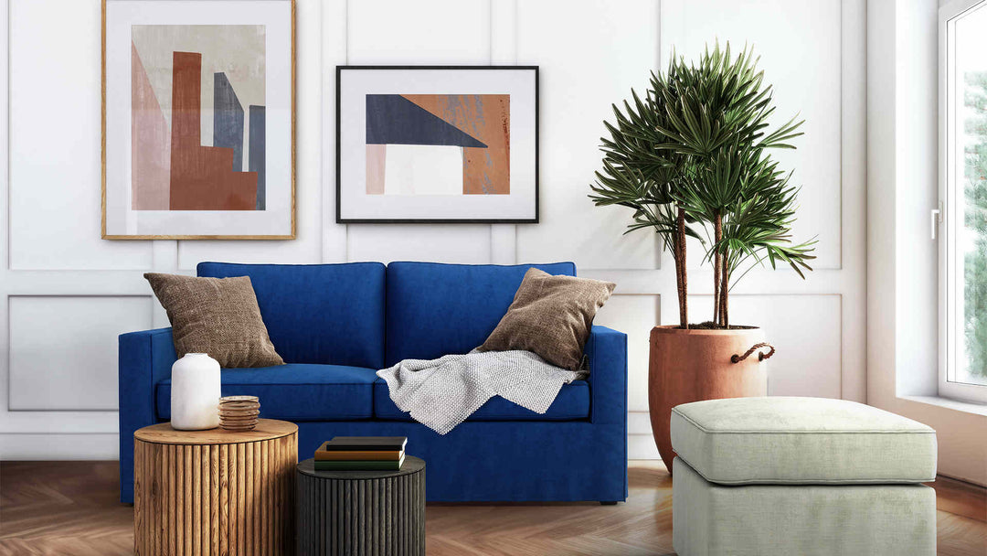 Modern Victorian living room with West Elm Henry sofa in Classic Velvet Cobalt and Performance Weave Stone slipcover
