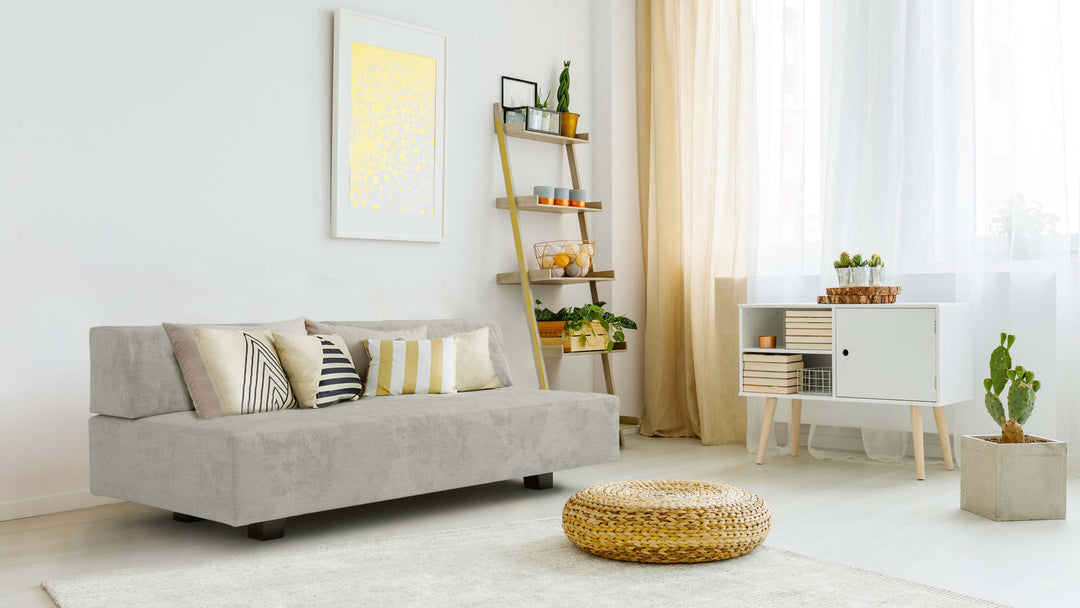 Bohemian living room with West Elm Tillary sofa in Performance Weave Stone fabric slipcover