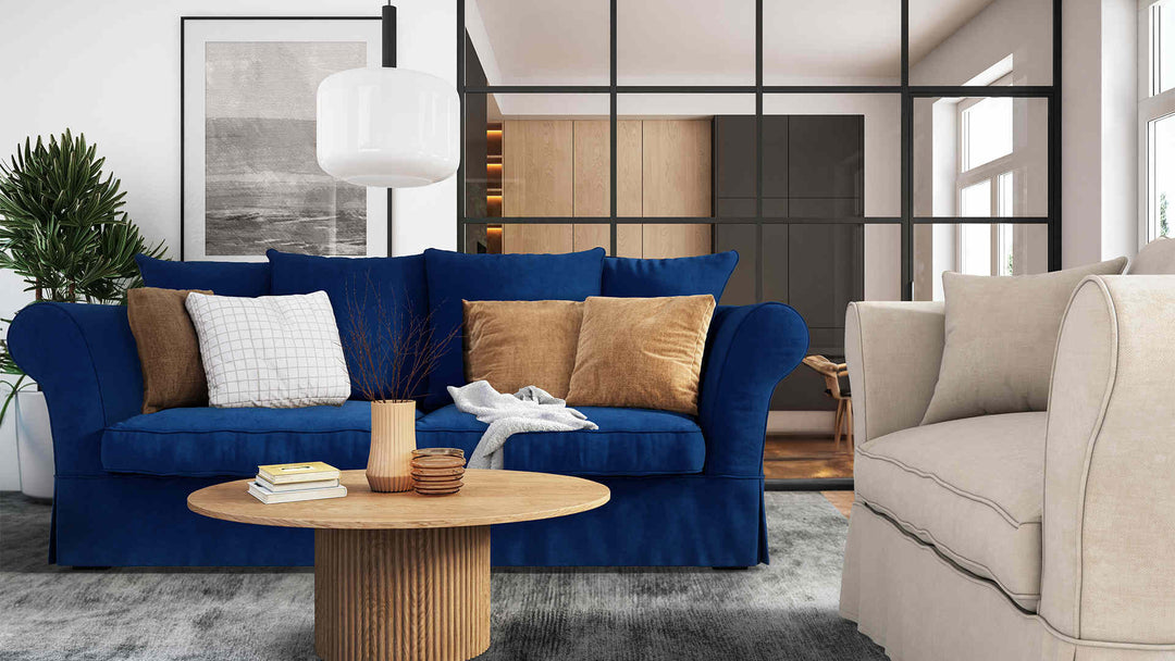 Modern living room with Maison du Monde Roma sofa in Classic Velvet Cobalt and Performance Weave Cream slipcover