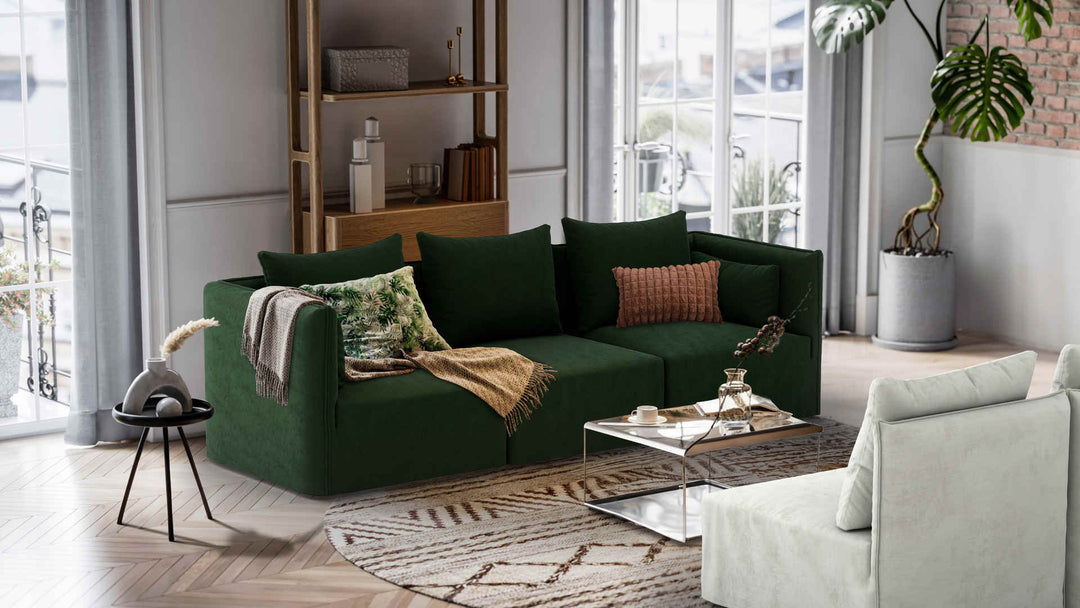 Nordic Minimalist living room with Elbgestoeber Elbdock sofa in Performance Weave Stone and Classic Velvet Forest Green slipcover
