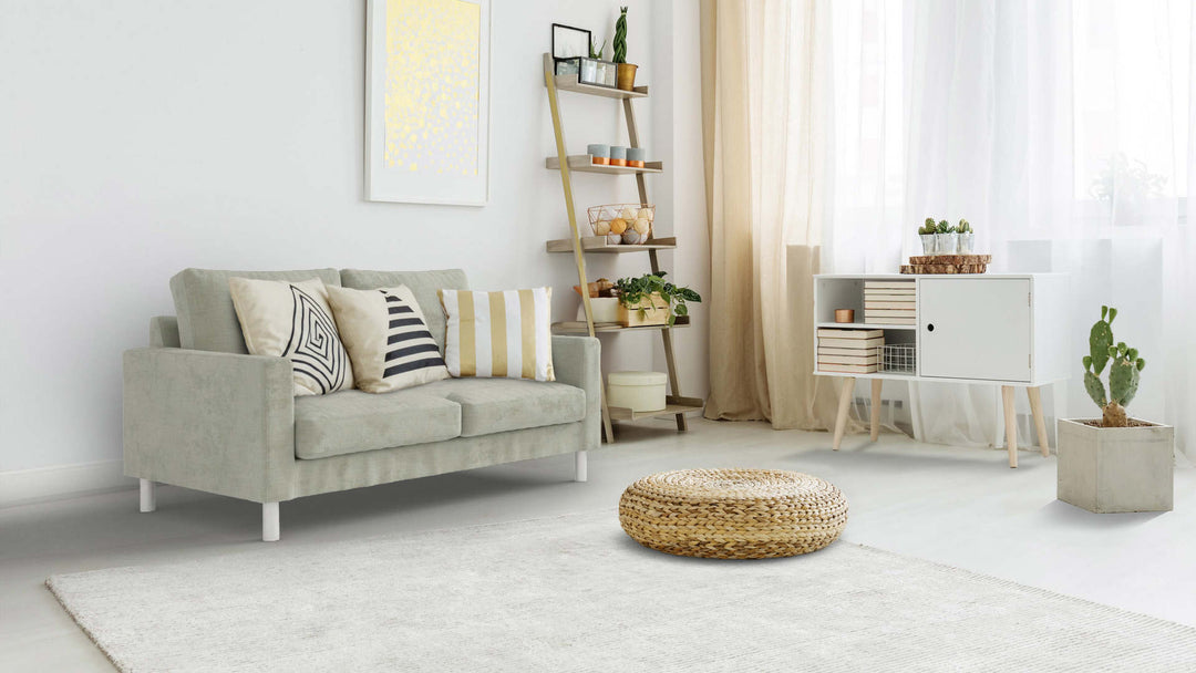 Bohemian living room with Muji Leather Sofa in Performance Weave Stone fabric slipcover