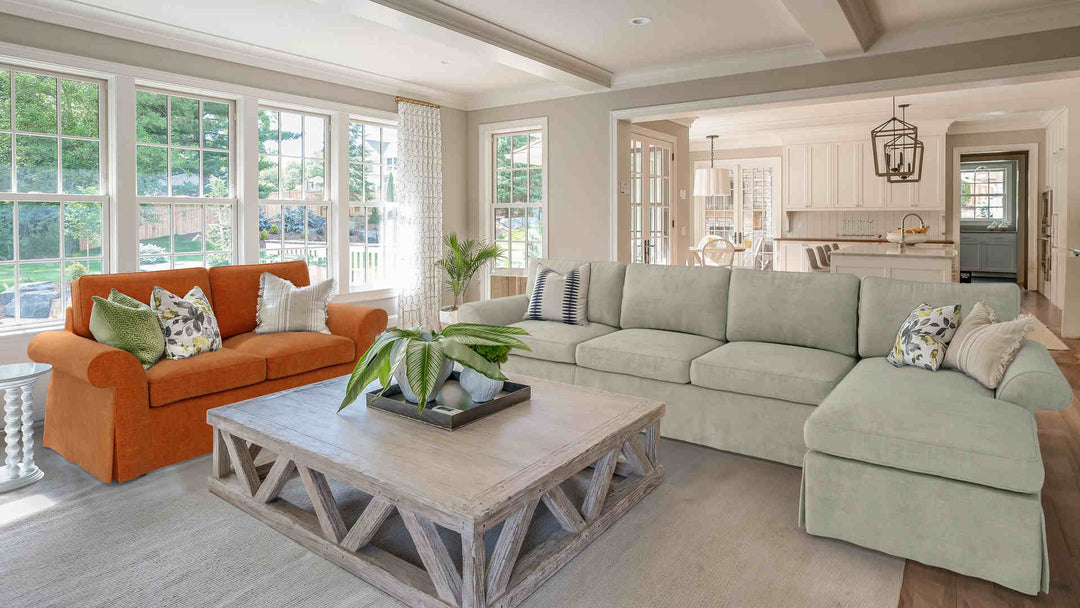 Rustic living room with Pottery Barn Pearce Roll Arm sofa in Comfort Chenille Burnt Orange and Performance Weave Stone slipcover