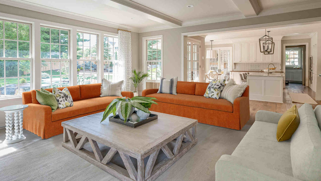 Rustic living room with Restoration Hardware Belgian Slope sofa in Comfort Chenille Burnt Orange and Performance Weave Stone slipcover