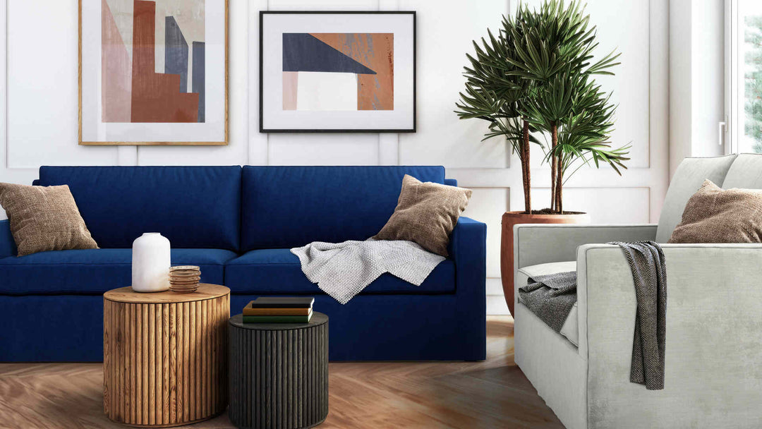 Modern Victorian living room with West Elm Henry sofa in Classic Velvet Cobalt and Performance Weave Stone slipcover