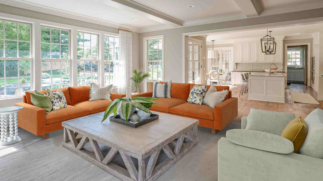 Rustic living room with West Elm Harmony sofa in Comfort Chenille Burnt Orange and Performance Weave Stone slipcover