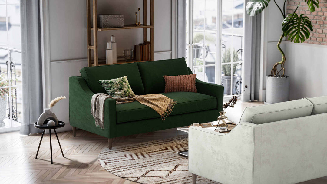 Nordic Minimalist living room with West Elm Paidge sofa in Performance Weave Stone and Classic Velvet Forest Green slipcover