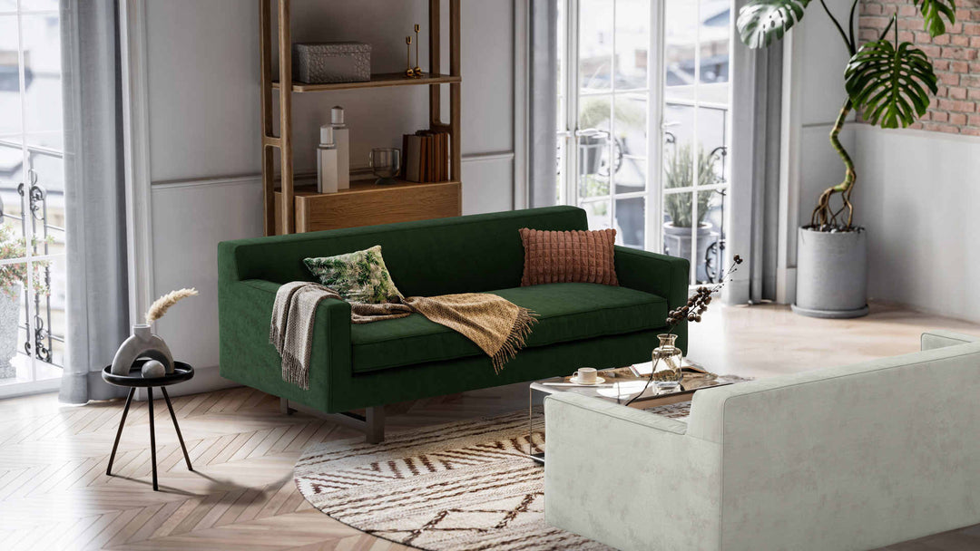 Nordic Minimalist living room with Room and Board Andre sofa in Performance Weave Stone and Classic Velvet Forest Green slipcover