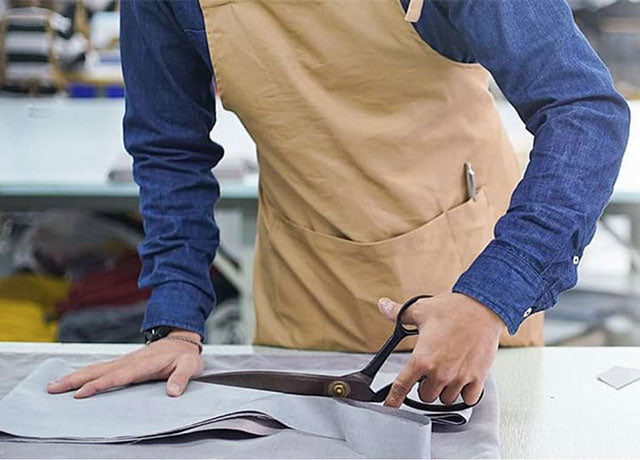 Pattern maker cutting through fabric tiles