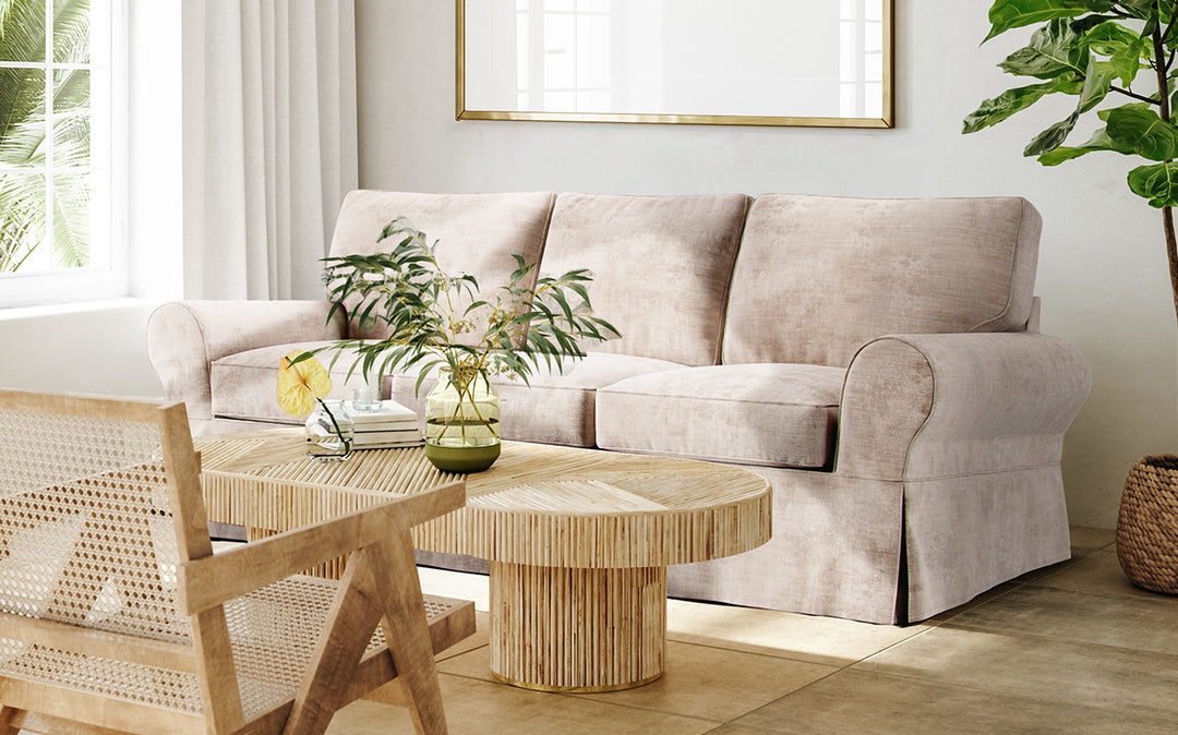 Bohemian living room featuring Pottery Barn Basic sofa with stain and liquid-resistant Performance Weave cream slipcover