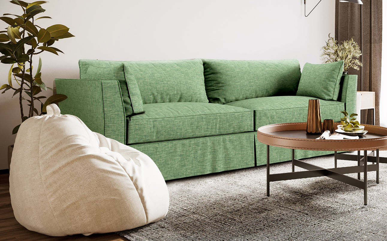 Stylish living room showcasing Rowe Darby sofa with Textured Weave basil green slipcover in 100% polyester upholstery fabric