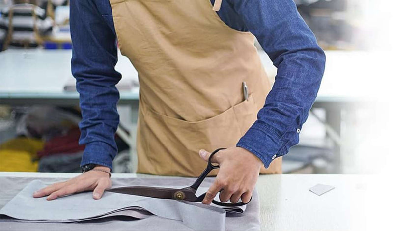 Fabricator cutting fabric tiles for slipcovers