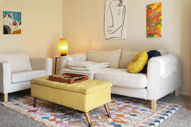 Bright living room featuring a white couch slipcovers from Comfort Works