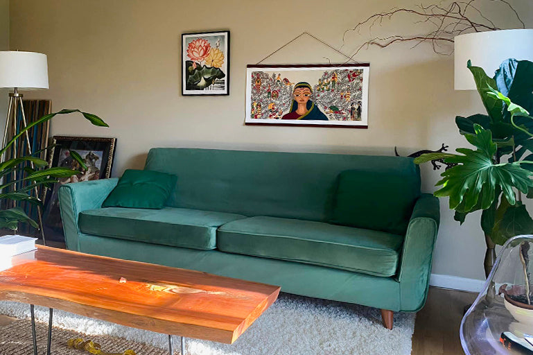 Stylish living room featuring a green sofa slipcover from Comfort Works, with custom couch covers for a tailored fit