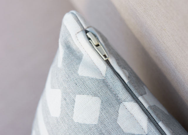 Close-up of sofa couch cushion in Sunbrella Fretwork Pewtwe slipcover