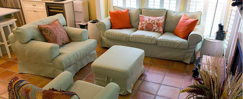 Customer photo: Custom modular sofa couch and footstool with Cotton Canvas Silver Sage slipcover in an eclectic living room