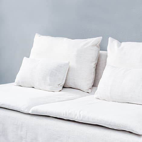 Close-up of IKEA SODERHAMN sofa cushion with White Cotton Canvas slipcover