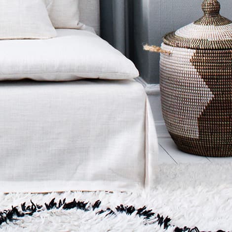 Close-up of IKEA SODERHAMN sofa bed with White Cotton Canvas slipcover