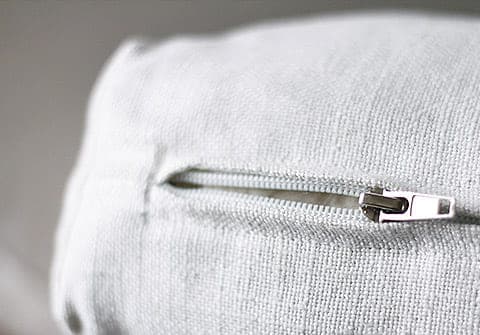 Close-up of sofa couch cushion slipcover zipper